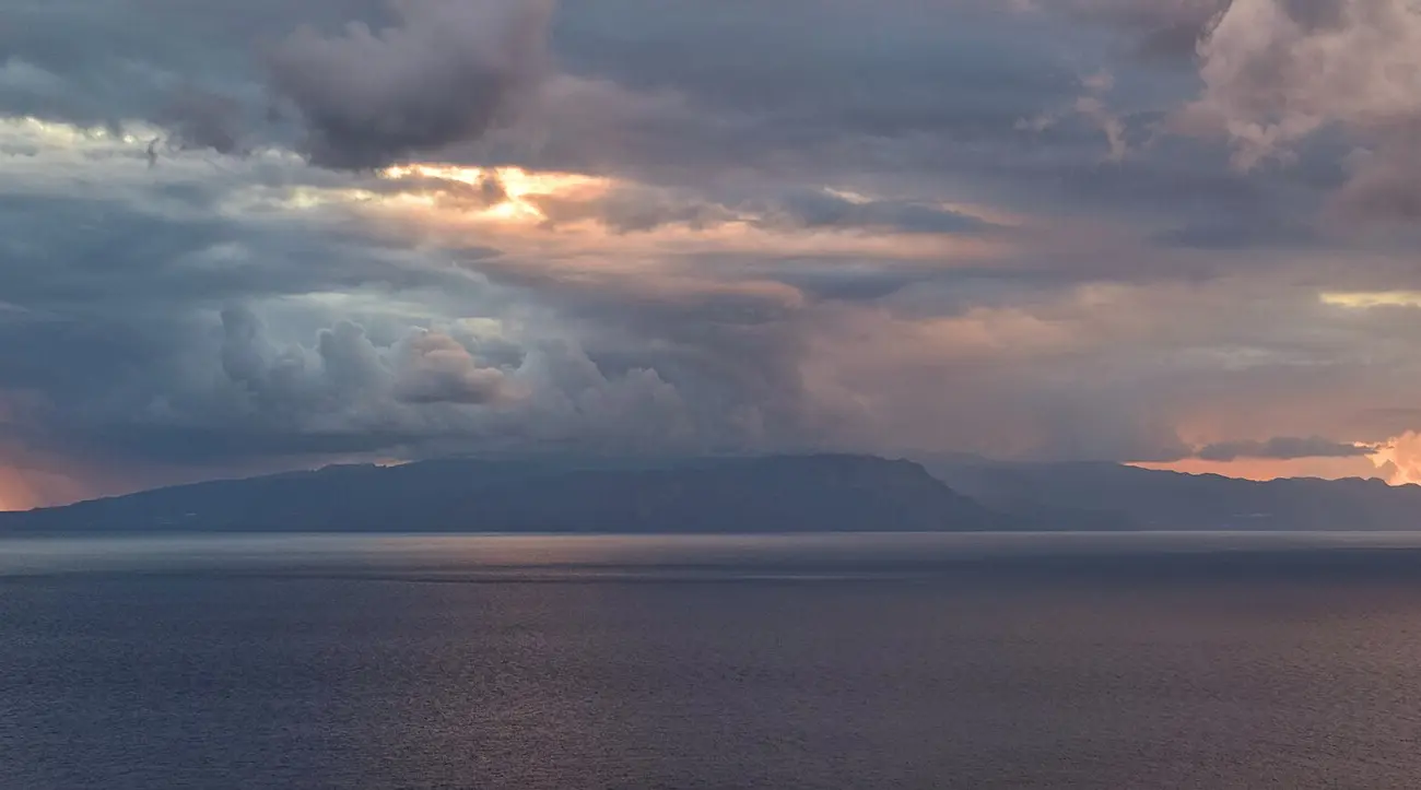 La Gomera on the horizon at sunset, seen from the west coast of Tenerife